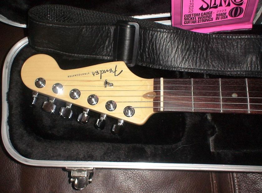   bar, Fender polish kit, a set of new ernie ball 9 gauge strings, and