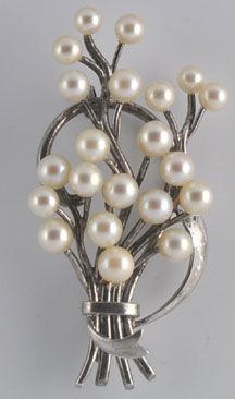 This is a wonderful sterling spray in pin with cultured pearls marked 