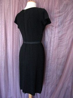 CHARMING EARLY 50s BLACK CREPE & SATIN LBD HAS A FAUX BOLERO DESIGN AT 